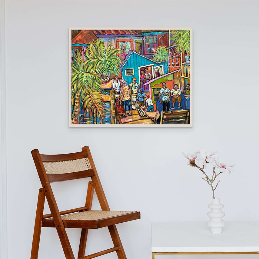 Colorful painting of a street scene on a wall above a wooden chair.