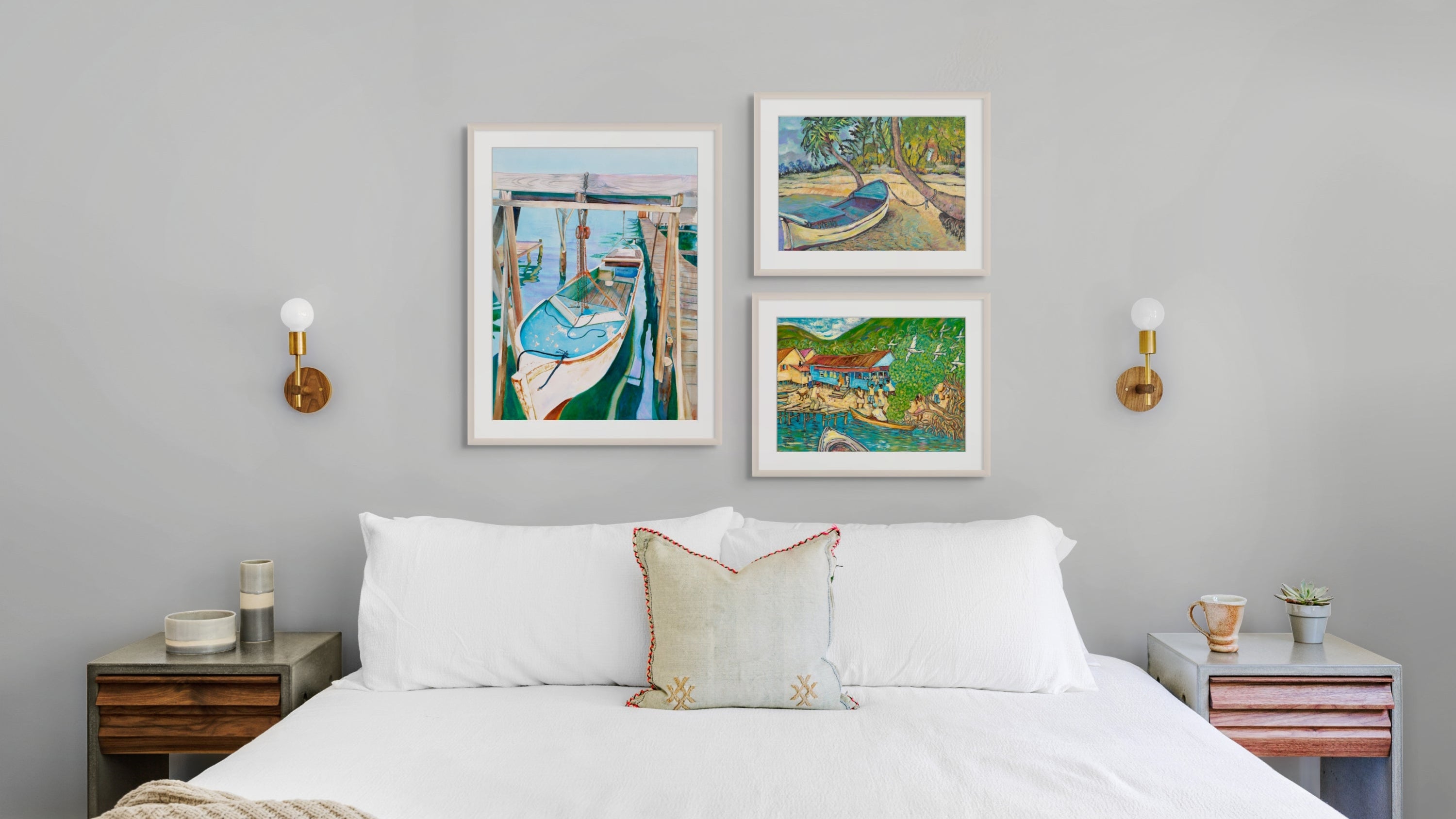 Bedroom with a bed, nightstands, and wall art depicting boats.