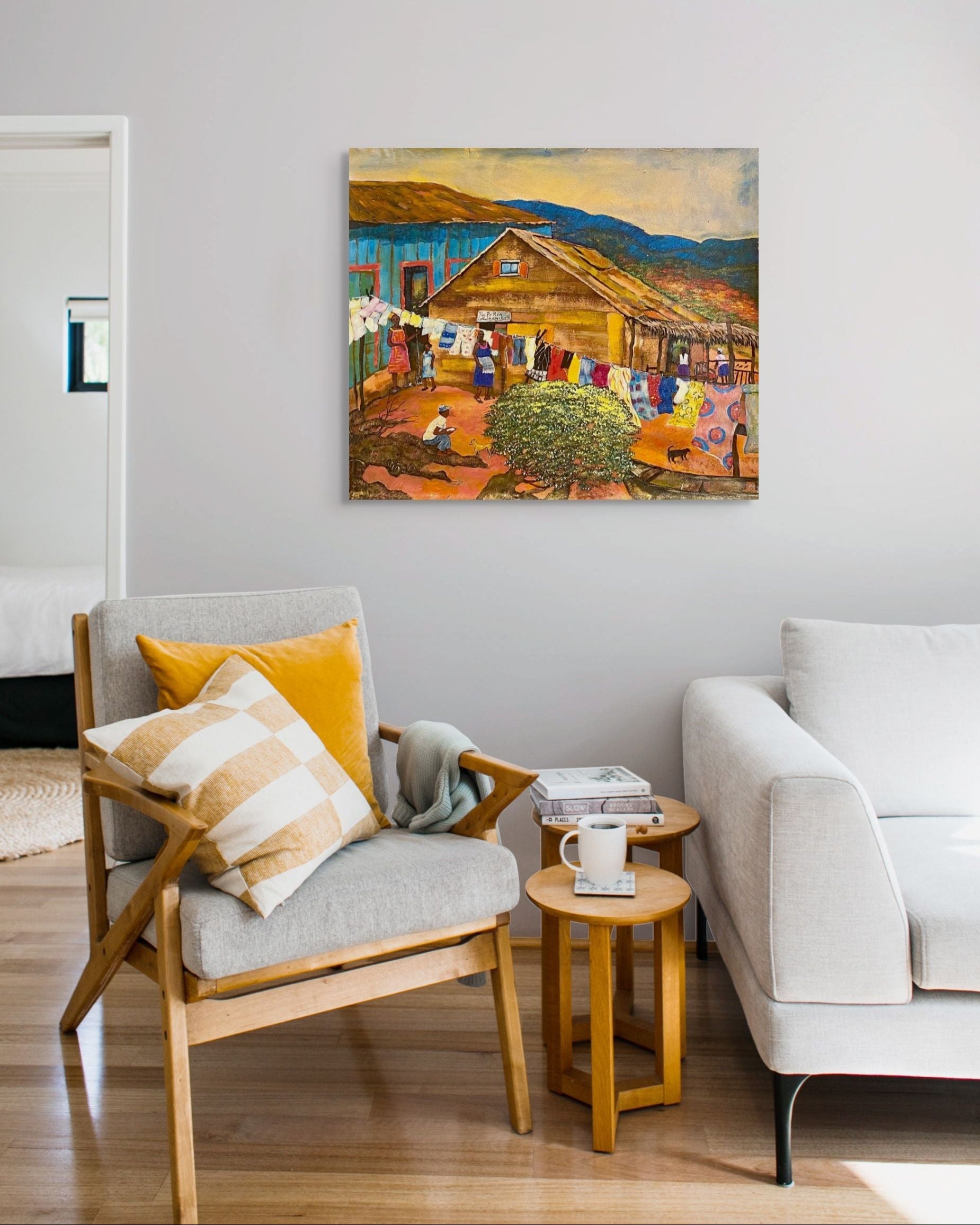 Living room with a painting of a rustic scene on the wall