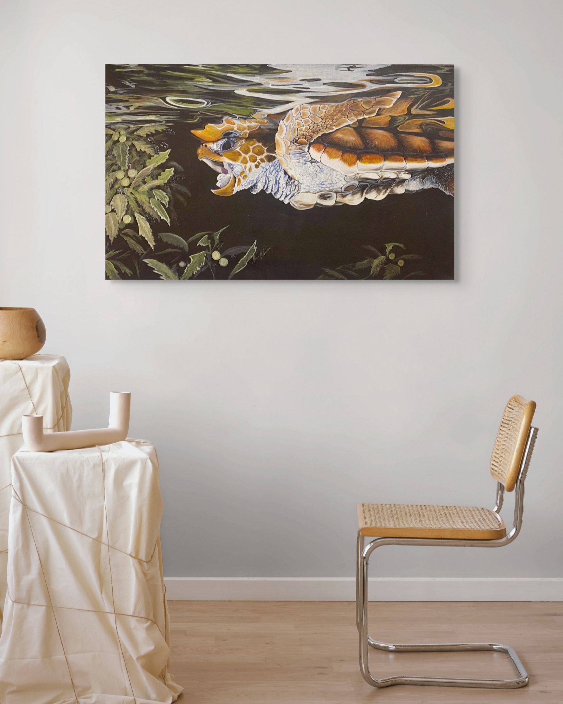 Artistic depiction of a sea turtle in water with seaweed, displayed on a wall in a minimalistic room.