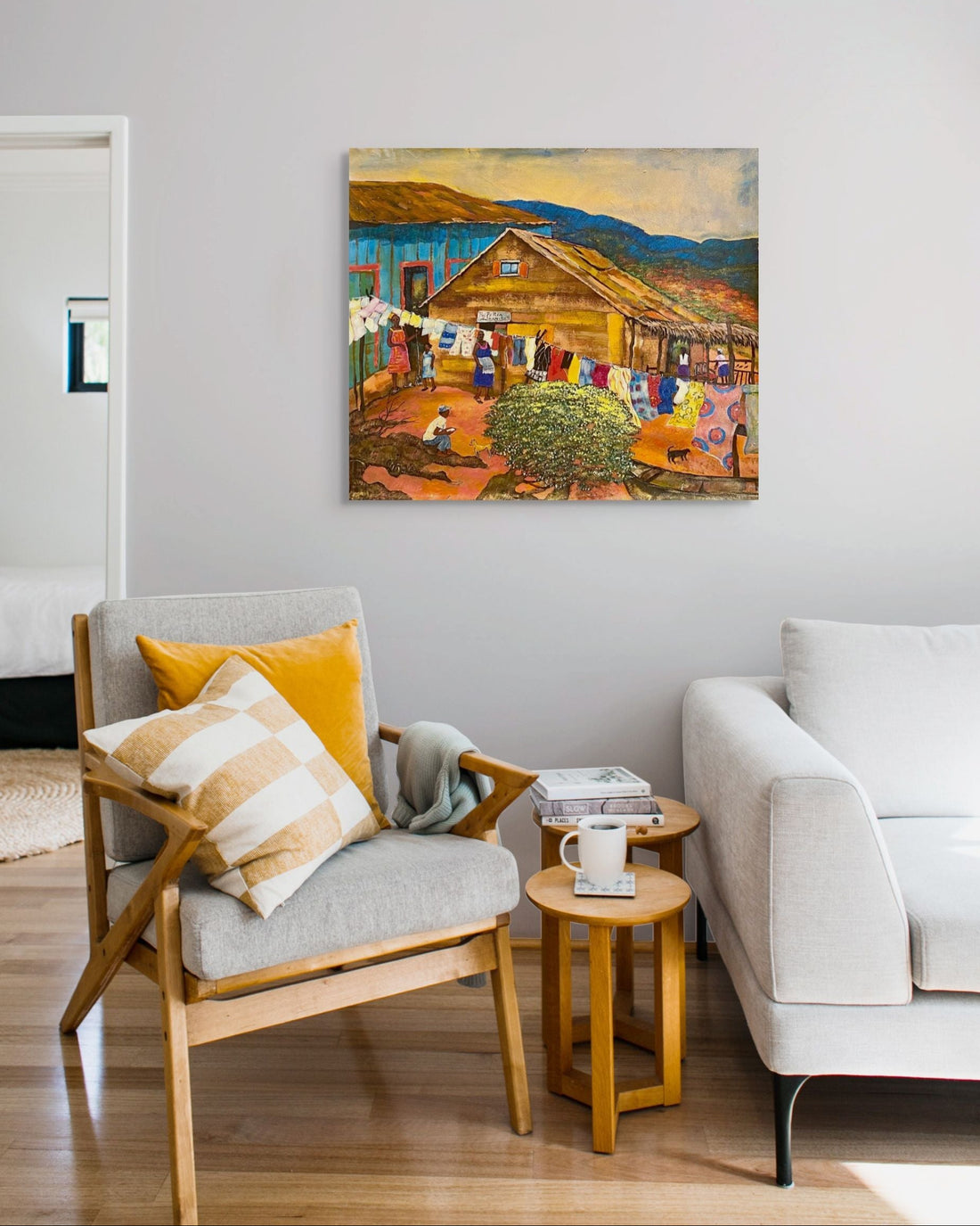 Living room with a painting of a rustic scene on the wall